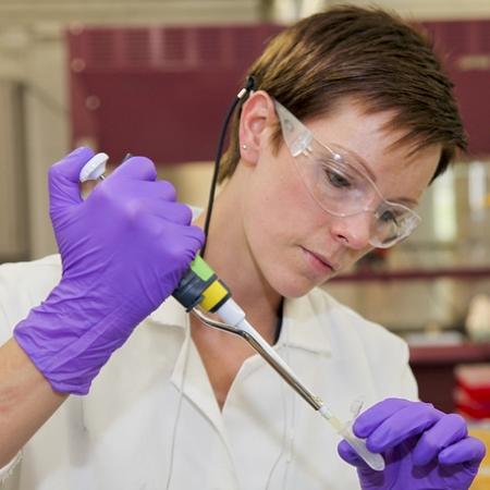 a photo of a women using a pipette